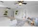 Spacious bedroom boasts modern decor, French doors, and a neutral color palette at 156 29Th N Ave, St Petersburg, FL 33704