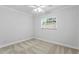 Simple bedroom with neutral carpeting, bright natural light and a ceiling fan at 156 29Th N Ave, St Petersburg, FL 33704