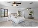 This spacious bedroom features wood shutters, ceiling fans, and neutral decor at 156 29Th N Ave, St Petersburg, FL 33704