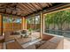 Cozy cabana featuring comfortable seating, a view of the pool, and open access to the backyard at 156 29Th N Ave, St Petersburg, FL 33704