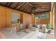 Well-appointed cabana with a wet bar, comfortable seating, and a tranquil view of the beautifully landscaped backyard at 156 29Th N Ave, St Petersburg, FL 33704