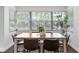 Charming dining room with natural light, hardwood floors, and comfortable seating at 156 29Th N Ave, St Petersburg, FL 33704