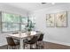 Charming dining room with natural light, hardwood floors, and comfortable seating at 156 29Th N Ave, St Petersburg, FL 33704