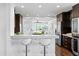 Entertainer's kitchen with a breakfast bar, stainless appliances and open access to the living area at 156 29Th N Ave, St Petersburg, FL 33704