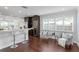 Bright living space featuring a kitchen breakfast bar and a seating area with plantation shutters at 156 29Th N Ave, St Petersburg, FL 33704