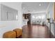 Wide view of living area with hardwood floors, kitchen access, and bright natural light at 156 29Th N Ave, St Petersburg, FL 33704