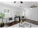 Stylish living room featuring plantation shutters, hardwood floors, and contemporary furnishings at 156 29Th N Ave, St Petersburg, FL 33704