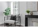 Comfortable chair with modern decor and plantation shutters allowing natural light to brighten this room at 156 29Th N Ave, St Petersburg, FL 33704