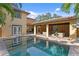 Beautiful pool area featuring a cabana, seamless indoor/outdoor flow, and dining area with outdoor kitchen at 156 29Th N Ave, St Petersburg, FL 33704