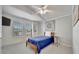 Cozy bedroom featuring natural light, a ceiling fan, carpet flooring and soothing neutral colors at 206 S Port Royal Ln, Apollo Beach, FL 33572