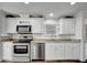 View of the kitchen featuring stainless steel appliances and granite countertops at 206 S Port Royal Ln, Apollo Beach, FL 33572
