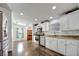 Bright kitchen with stainless steel appliances, granite countertops and wood-look flooring at 206 S Port Royal Ln, Apollo Beach, FL 33572
