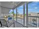 Relaxing screened porch with a ceiling fan, offering an inviting outdoor space with views of the community at 206 S Port Royal Ln, Apollo Beach, FL 33572
