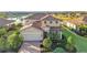 Beautiful two-story home boasts a tile roof, manicured landscaping, and a lake view at 6467 Willowshire Way, Bradenton, FL 34212