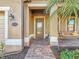 The exterior features a front porch with a swing and a glass front door at house number 6467 at 6467 Willowshire Way, Bradenton, FL 34212