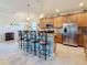 Stylish kitchen with stainless steel appliances, granite countertops, and a convenient breakfast bar at 6467 Willowshire Way, Bradenton, FL 34212