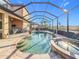 This screened-in pool area with hot tub and brick-paved patio is perfect for outdoor living and entertaining at 6467 Willowshire Way, Bradenton, FL 34212