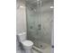 Modern bathroom featuring a glass shower and stylish toilet at 8807 Oak Cir, Tampa, FL 33615