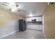 Well-lit kitchen featuring white cabinets, stainless steel appliances, and modern tile flooring at 8807 Oak Cir, Tampa, FL 33615