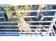 Top-down view of a black car from a balcony featuring two lock boxes at 308 2Nd St N # 202, Bradenton Beach, FL 34217