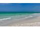 Gorgeous beach view featuring white sands and emerald green waters, perfect for relaxation and recreation at 308 2Nd St N # 202, Bradenton Beach, FL 34217