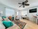 Bright living room showcasing coastal decor, modern amenities, and a comfortable seating area with natural light at 308 2Nd St N # 202, Bradenton Beach, FL 34217