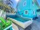 Inviting pool area with tiled accents and a comfortable seating arrangement, ideal for relaxation at 308 2Nd St N # 202, Bradenton Beach, FL 34217
