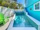 Inviting pool featuring a playful yellow duck, tiled accents, and steps leading to a second story balcony at 308 2Nd St N # 202, Bradenton Beach, FL 34217