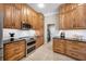 Well-equipped kitchen features stainless appliances, granite countertops, and plenty of solid wood cabinet space at 5501 E Longboat Blvd, Tampa, FL 33615