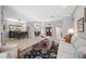 Spacious open concept living room with tile floors, dining area, and a view of the front door at 5501 E Longboat Blvd, Tampa, FL 33615