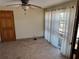 Bedroom with tile flooring, neutral walls, and a window with sheer curtains, awaiting your personal touch at 8075 Gulf Blvd, St Pete Beach, FL 33706