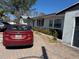 Full front view with brick driveway and some landscaping at 8075 Gulf Blvd, St Pete Beach, FL 33706