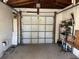 Spacious garage with overhead door, perfect for parking and storage or workshop possibilities at 8075 Gulf Blvd, St Pete Beach, FL 33706