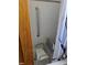 This bathroom features a tile shower with a built-in seat and grab bar for easy accessibility at 8075 Gulf Blvd, St Pete Beach, FL 33706