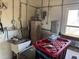 Functional utility area with water heater, sink, and storage space for household needs at 8075 Gulf Blvd, St Pete Beach, FL 33706