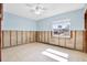 Bedroom featuring tile floors, natural light, and ready for new finishes and personal touches at 8421 Flagstone Dr, Tampa, FL 33615