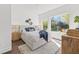 Cozy bedroom with stylish furnishings, a comfortable bed, and a view of the neighborhood at 881 6Th S Ave, St Petersburg, FL 33701