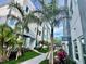 Stunning modern townhome exteriors featuring lush tropical landscaping along a welcoming walkway at 881 6Th S Ave, St Petersburg, FL 33701