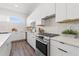Well-equipped modern kitchen with stainless steel appliances and ample countertop space at 881 6Th S Ave, St Petersburg, FL 33701