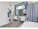 Bright bathroom featuring double vanities, a soaking tub, and blue accent walls at 9229 Water Hazard Dr, Hudson, FL 34667