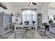 Cozy home office with a large window, stylish furniture, and ample natural light at 9229 Water Hazard Dr, Hudson, FL 34667