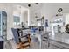 Bright home office with a decorative desk, shelving, and neutral finishes with easy access to the main living area at 9229 Water Hazard Dr, Hudson, FL 34667
