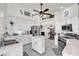 Bright kitchen with stainless steel appliances, white cabinets, and a cozy breakfast nook at 9229 Water Hazard Dr, Hudson, FL 34667