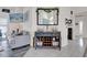 Living room featuring modern décor, a wine rack, and a mounted television above a buffet at 9229 Water Hazard Dr, Hudson, FL 34667
