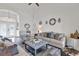 Bright living room with neutral tones, stylish decor, and comfortable seating arrangement at 9229 Water Hazard Dr, Hudson, FL 34667