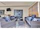 Relaxing outdoor seating on covered patio with nice furniture and television at 9229 Water Hazard Dr, Hudson, FL 34667