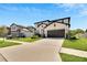 Charming two-story home featuring a well-manicured lawn and a two car garage with a neutral color scheme at 13526 Palmera Vista Dr, Riverview, FL 33579