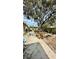 Expansive backyard with a patio area, mature trees, and a built-in fire pit, perfect for outdoor entertaining at 1670 Monterey Dr, Clearwater, FL 33756