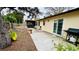 Backyard featuring a patio, fire pit, mature trees, and outdoor seating at 1670 Monterey Dr, Clearwater, FL 33756