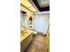 Cozy bathroom featuring a vanity, toilet and bathtub with decorative starfish and patterned shower curtain at 1670 Monterey Dr, Clearwater, FL 33756